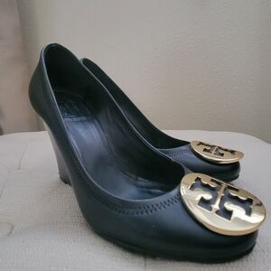 Black Leather Wedge Pumps with Gold Logo Medallion